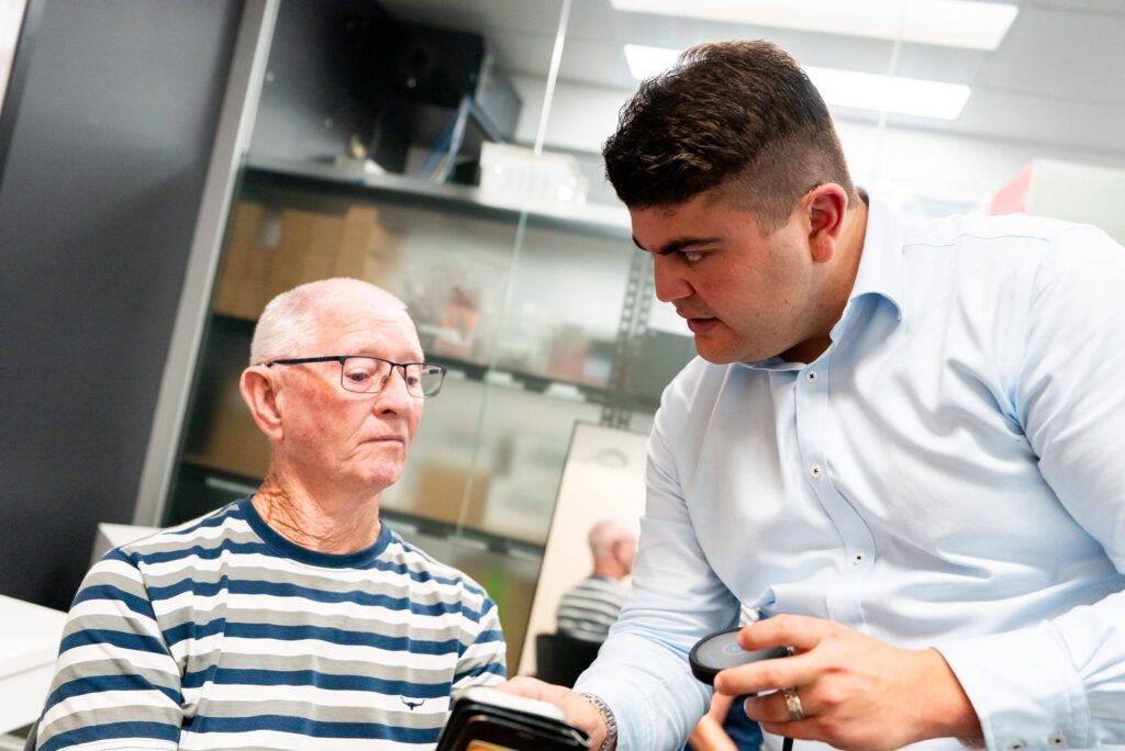 Audiologist explaining cochlear implant options to a patient