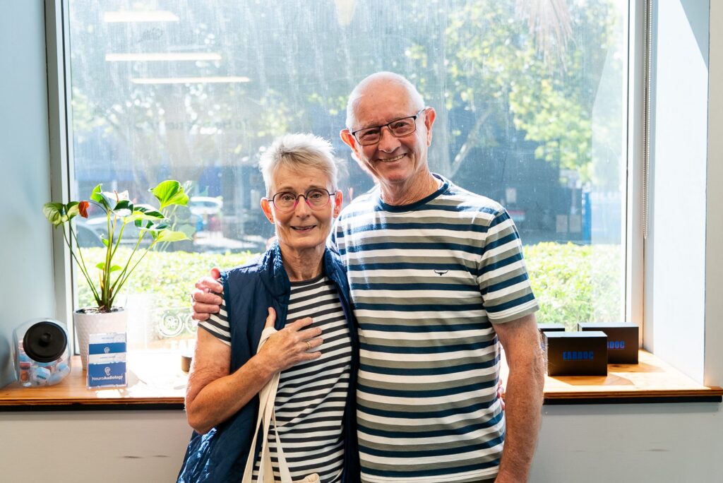 Smiling couple enjoying conversation after better hearing